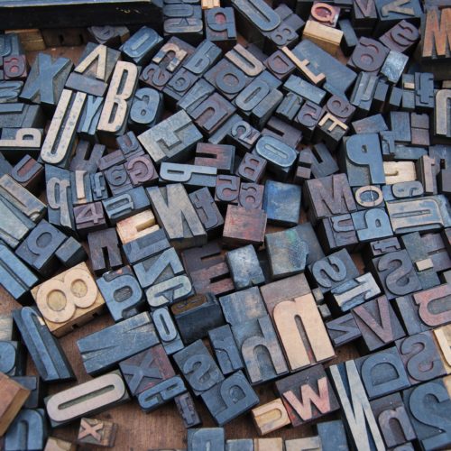 Press letter stamps in a pile