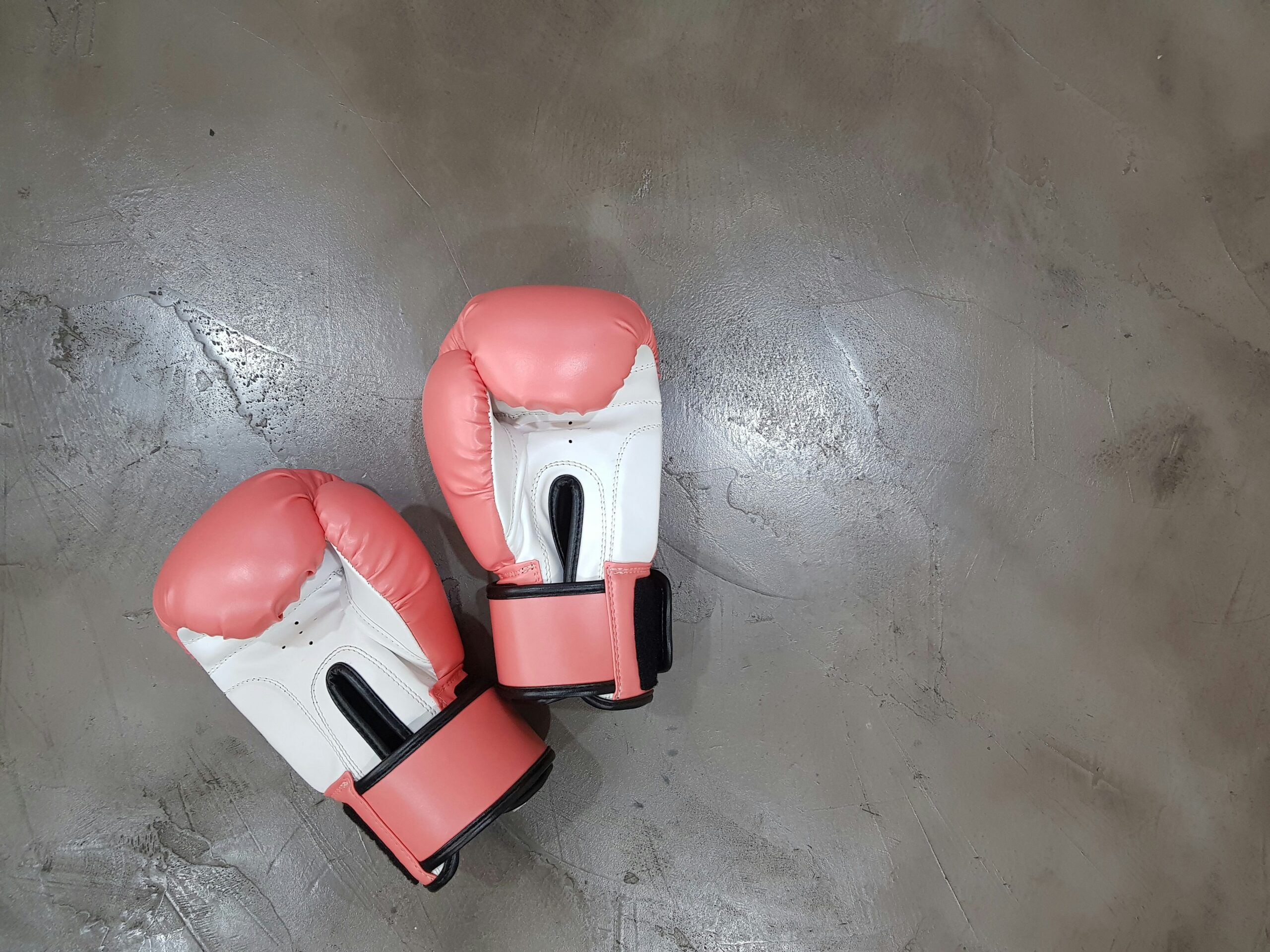 Pink boxing gloves on grey background - transformation programme assurance