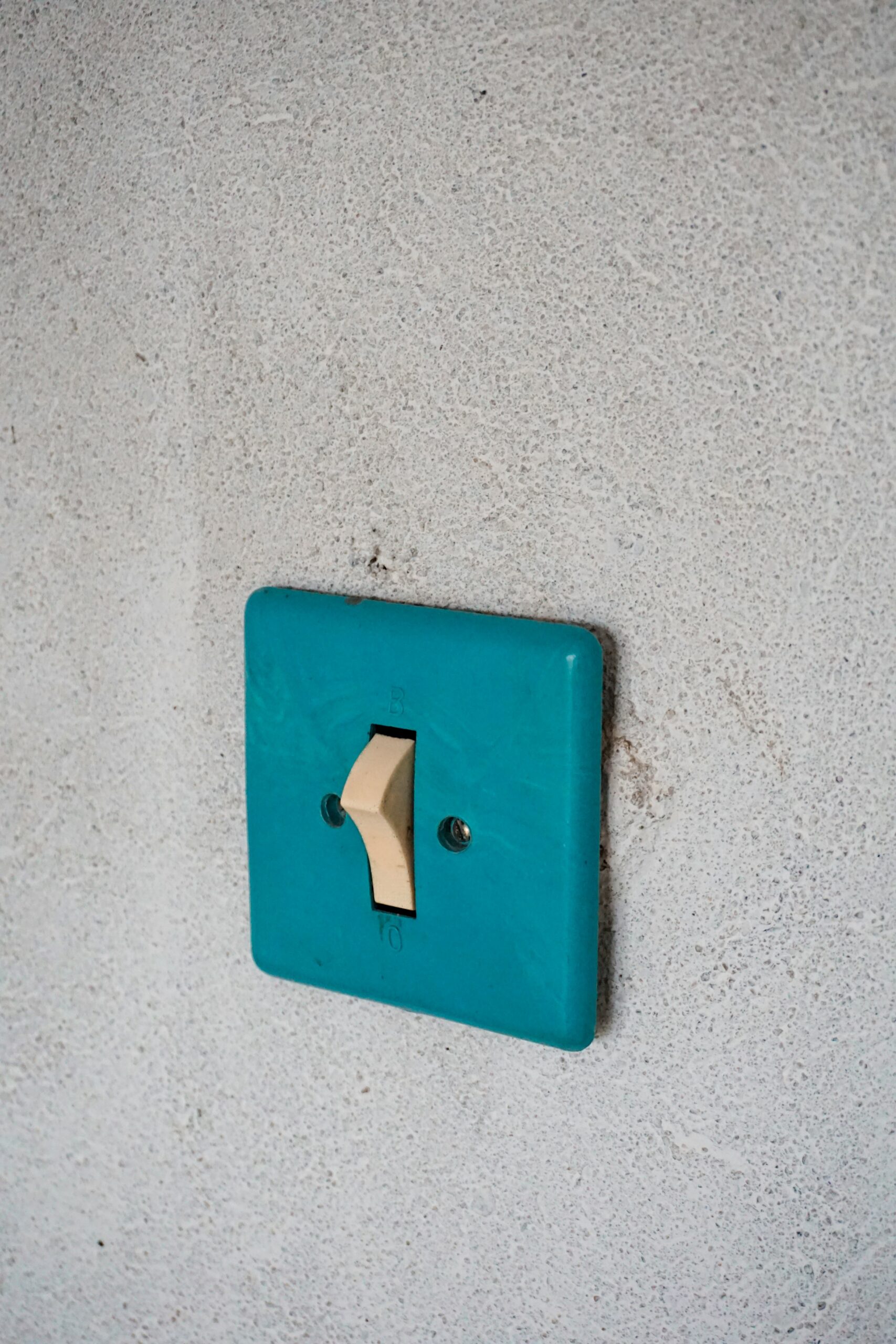 Blue light switch on white wall - Change Capability Maturity